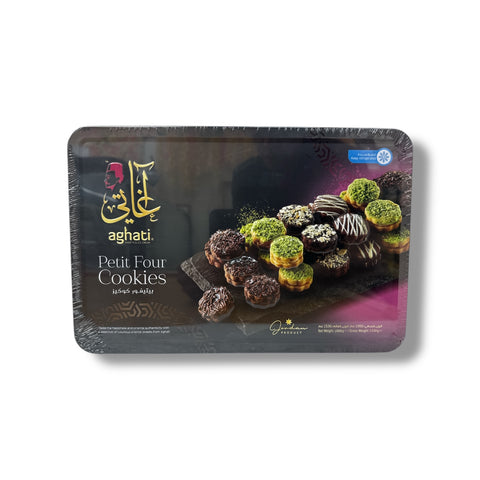 Aghati Petit Four Cookies in a 1kg tray, featuring a colorful assortment of gourmet petits fours topped with premium chocolate, pistachios, and coconut.