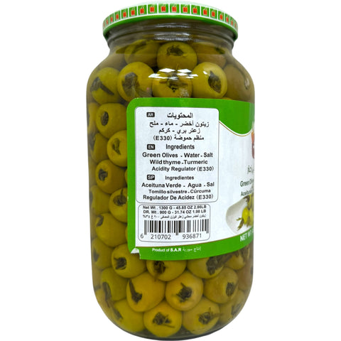 Close-up of Alahlam green olives, stuffed thyme, highlighting their unique flavor and texture.