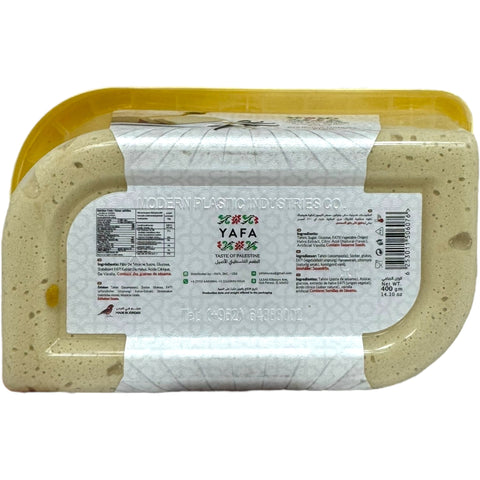 Yafa plain halva 400g on a wooden plate, ideal for enjoying a traditional halva snack.