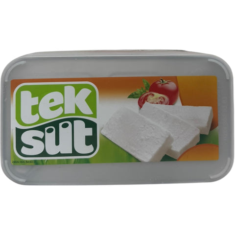 Tek Sut sheep milk cheese 1kg displayed in a rustic setting, highlighting its artisanal characteristics and delicious taste.