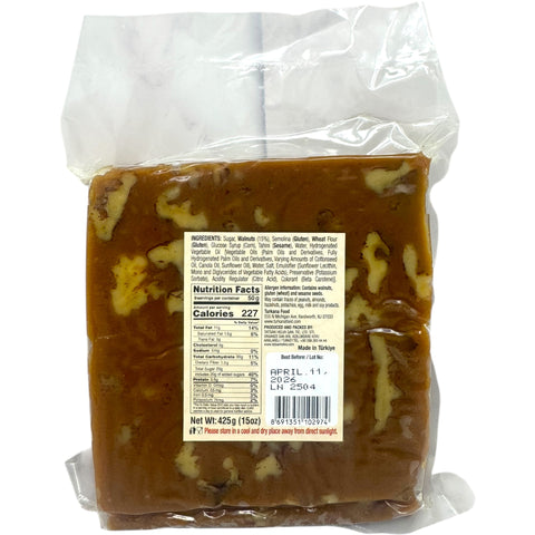 Close-up image of Tatsan carmel walnut halva 454g, representing traditional halva sweets with its smooth caramel layer and crunchy walnuts.