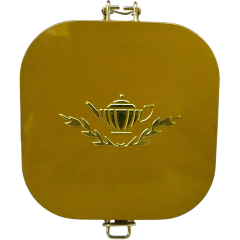 Loose leaves of Ahmad cardamom tea displayed with cardamom pods, highlighting the premium quality ingredients.