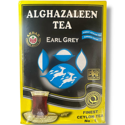 Alghazaleen Earl Grey tea leaves in a decorative bowl, showcasing the high-quality ingredients for brewing an aromatic beverage.