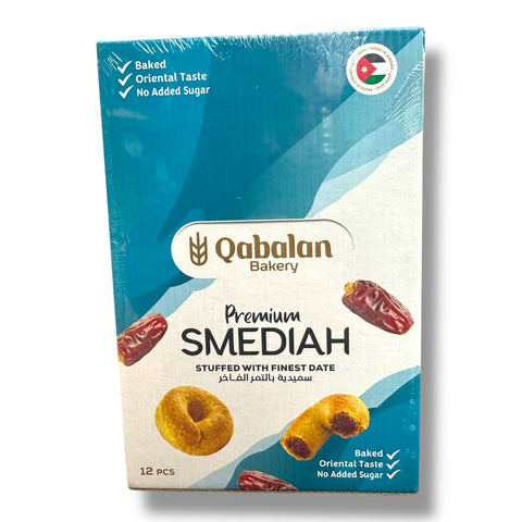 Qabalan Premium SMEDIAH - 12pc packaging showcasing the product. This box of premium middle eastern sweets features rich dates and highlights that it is baked, has an oriental taste, and contains no added sugar.