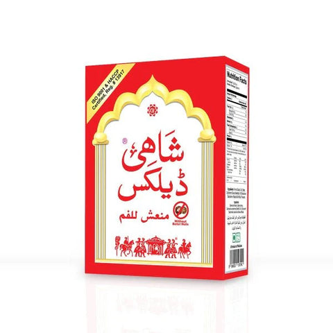 Shahi Deluxe Supari natural mouth freshener in red packaging with Urdu text and decorative gold arch design