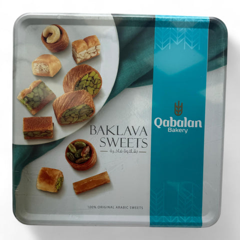 Delicious assortment of Qablan Mix Baklava 500 G showcasing layers of flaky pastry and nuts, perfect for dessert lovers.