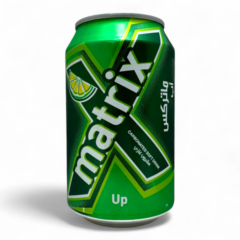Matrix Up Carbonated Drink 330ml in a chilled glass, showcasing its refreshing bubbles and vibrant packaging.