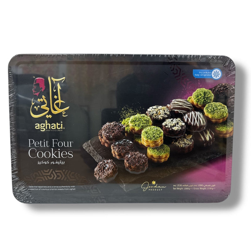 Aghati Petit Four Cookies in a 1kg tray, featuring a colorful assortment of gourmet petits fours topped with premium chocolate, pistachios, and coconut.
