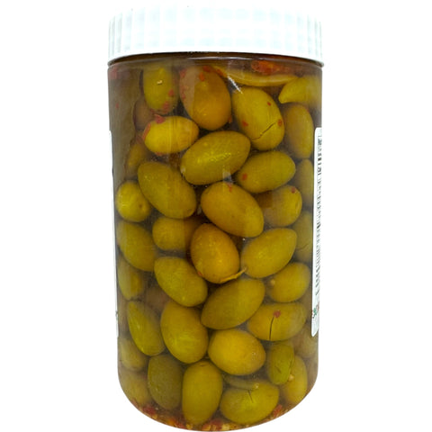 Close-up view of Yafa spicy green olives, highlighting the vibrant colors and spices that enhance the flavor of these popular spicy green olives.