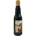 Sadaf pomegranate molasses 300ml poured into a small dish, highlighting its thick consistency and deep reddish hue.