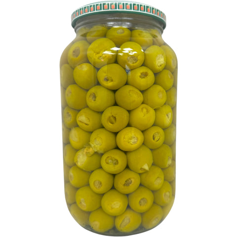 A close-up of Alahlam green olives stuffed with lemon, highlighting the succulent filling and vibrant color of these stuffed olives with lemon.