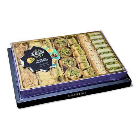 Artistic arrangement of Al Nejmah Sweets assorted baklava package, showcasing the Super size (500g) mix of delectable baklava.