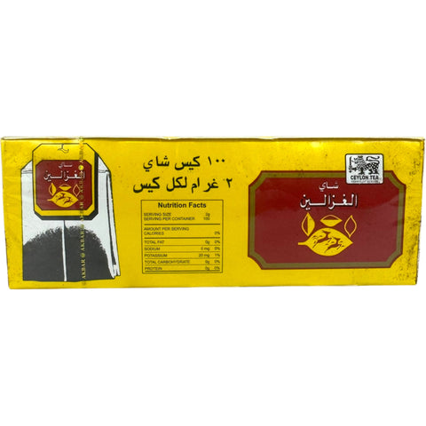 Alghazaleen tea bag displayed alongside a steaming cup of organic Arabic tea.
