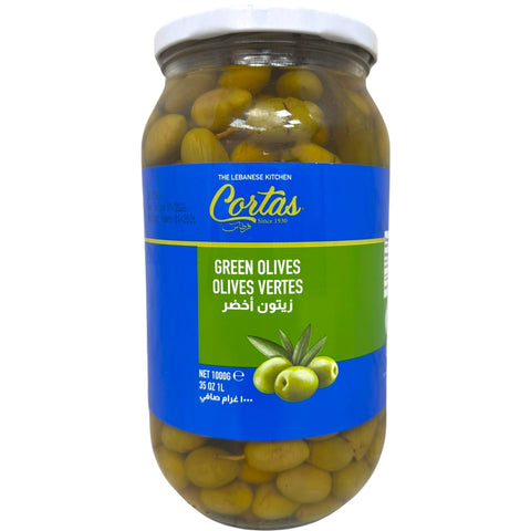 Cortas green olives in a jar, showcasing their vibrant color and delicious texture. Perfect for adding flavor to dishes.