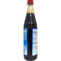 Cortas pomegranate molasses 500g - the product showcased with a pouring shot demonstrating its thick texture.