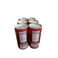 a group of six cans of soda on a white background
