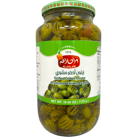 Al ahlam grilled green olives in a stylish jar, showcasing premium quality and taste.