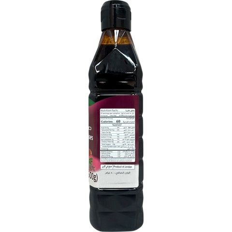 Close-up of Durra pomegranate molasses highlighting its glossy finish and vibrant packaging.