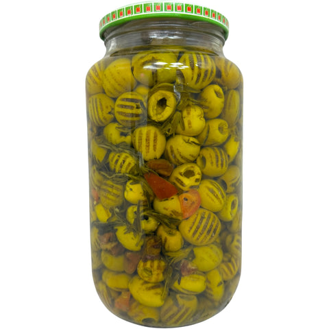 Close-up of Al ahlam grilled green olives, highlighting their vibrant color and texture.