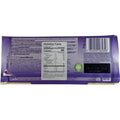 Close-up of Milka white chocolate bar highlighting its smooth texture and branded logo.
