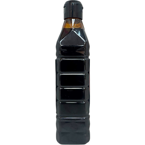 Durra pomegranate molasses displayed with fresh pomegranates, illustrating the natural ingredients used in the product.