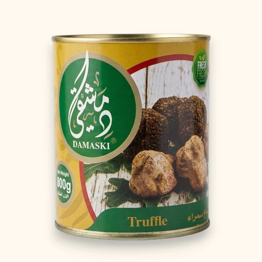 Damaski Truffle 800g can of whole truffles preserved in water, featuring earthy brown whole truffles on a rustic wooden background.