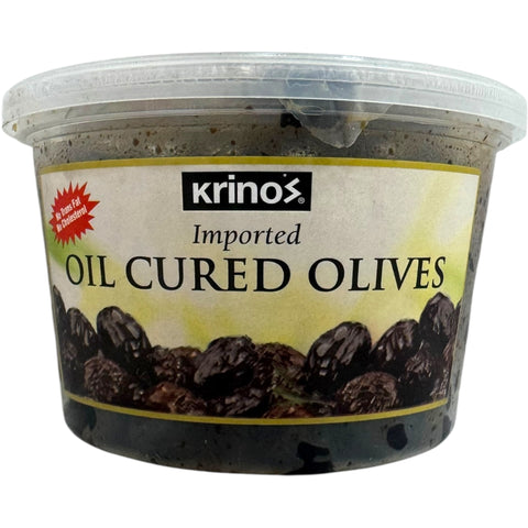 Krinos imported oil cured olives showcasing a variety of cured olive varieties, perfect for enhancing salads and Mediterranean dishes.