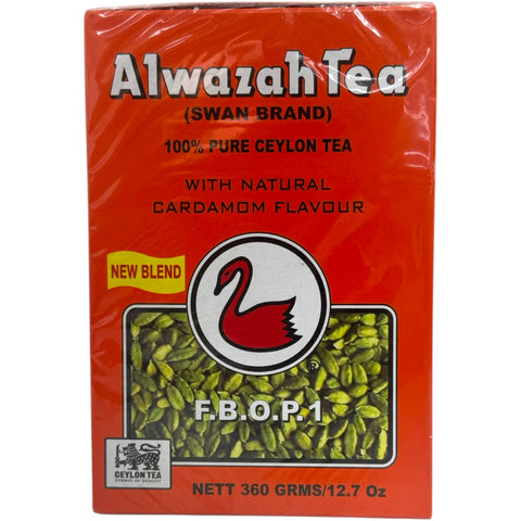 Alwazah black loose tea with cardamom tea leaves displayed in a rustic setting.
