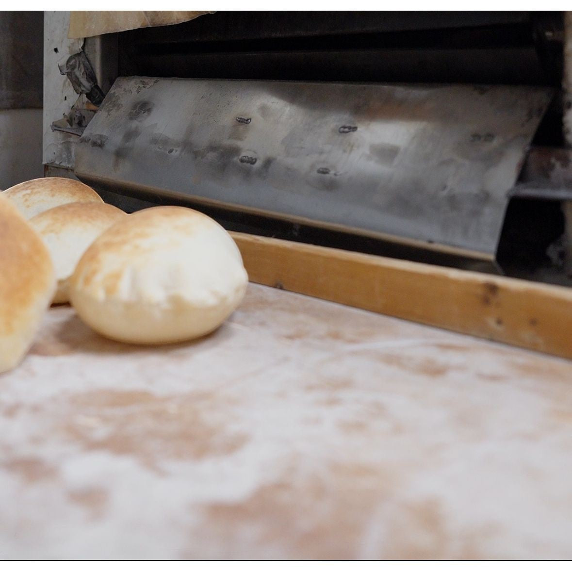 Fresh Baked Pita Bread - 10 Pieces of Soft, Chewy, showcasing the freshly baked texture and golden color, ideal for Mediterranean dishes.