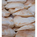 Fresh Baked Pita Bread - 10 Pieces of Soft, Chewy, arranged on a wooden board, highlighting its light and airy texture, perfect for wraps and dips.