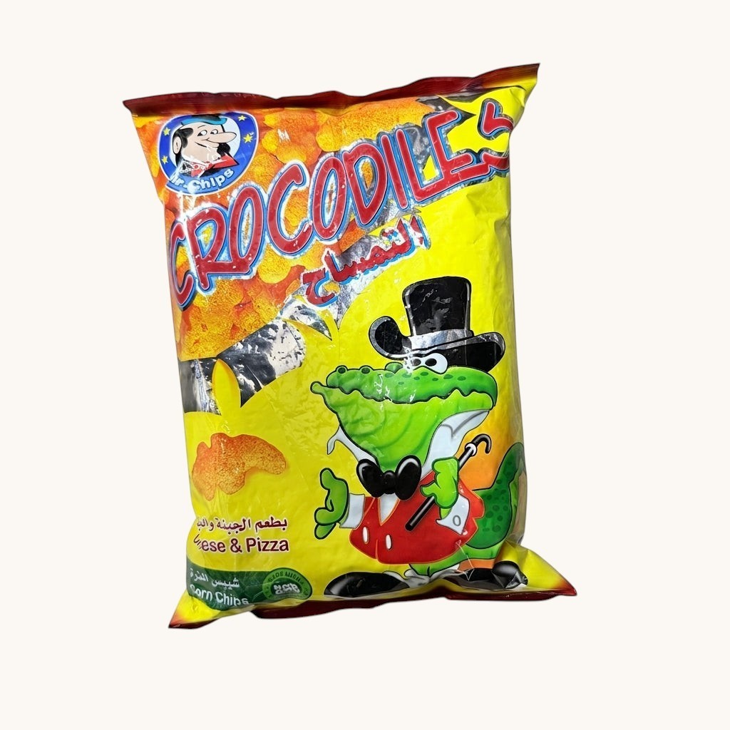 Albasha Mr. Chips Crocodile Cheese & Pizza Corn Chips 80g bag with cartoon crocodile mascot.