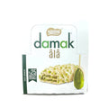 Nestle Damak Ala Pistachio White Chocolate Coated Wafer 30g x 12 package featuring a delicious white chocolate coated wafer with pistachio filling.