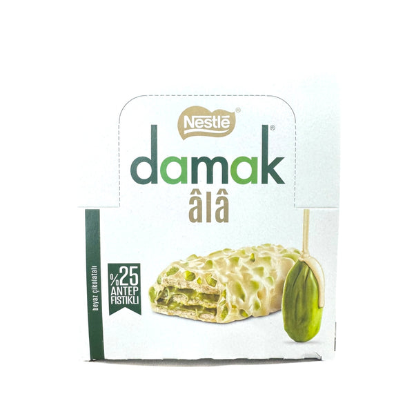 Nestle Damak Ala Pistachio White Chocolate Coated Wafer 30g x 12 package featuring a delicious white chocolate coated wafer with pistachio filling.