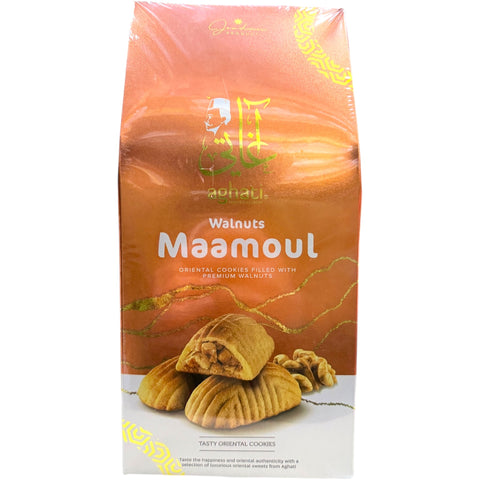 Aghati – Walnuts Maamoul traditional pastry displayed elegantly on a wooden table.