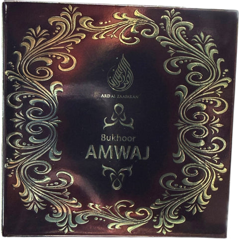 Close-up view of Amwaj Bukoohr, a premium perfume highlighting its elegant packaging.