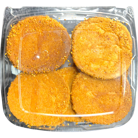 A close-up of a bite taken from Sesame Butter Cookies – Olive Mountain Bakery, revealing a soft and chewy texture.