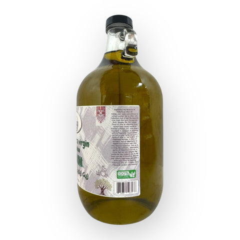 Serving suggestion with Palestinian Extra Virgin Olive Oil showcasing the premium quality olive oil drizzled over a salad.