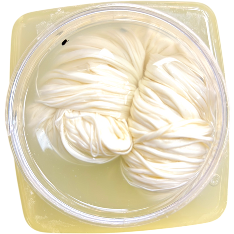 Syrian Shallal Braided String Cheese – 650g | AlBasha displayed in packaging, showcasing its unique braided shape.