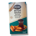 Hamdan Breadsticks - Basrawi showcasing a box design with crispy breadsticks snacks, accompanied by a cup of tea.