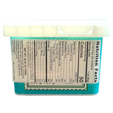 Yorsan Half Fat White Cheese 750g displayed on a wooden cutting board with fresh herbs and fruits.