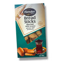 Hamdan Breadsticks - Basrawi in a package featuring a traditional glass of tea, highlighting crispy breadsticks snacks with sesame flavor.
