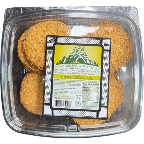 Delicious Sesame Butter Cookies from Olive Mountain Bakery, showcasing a golden-brown color and sprinkled sesame seeds.