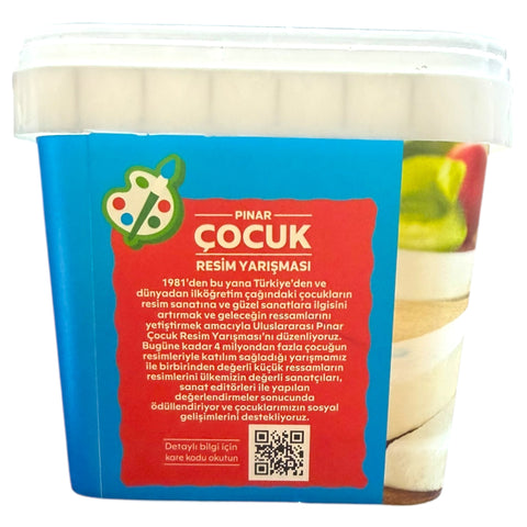 Lifestyle shot featuring PINAR KAHVALTI KEYFI WHITE CHEESE 800G on a breakfast table with fresh bread and tomatoes.