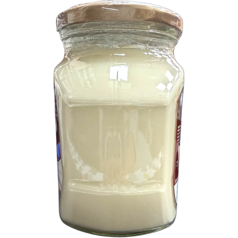 Pinar Premium Cheddar Cheese packaging displayed elegantly, emphasizing quality and freshness.