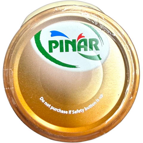 Pinar Premium Cheddar Cheese grated and sprinkled over a delicious pasta dish, enhancing flavor and presentation.