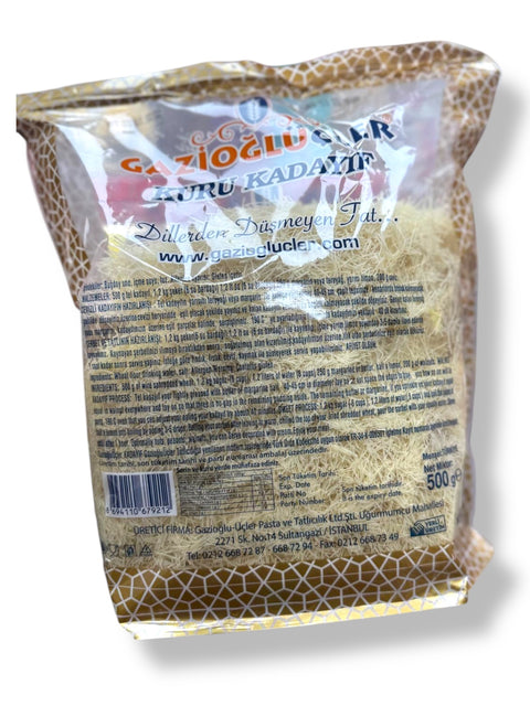 The back view of the Gazioglu Kuru Kadaif 500Gr - Premium Kunafe Dough for Authentic Dessert Creations packaging by ALBASHA Store, showcasing detailed product information. Ideal for bakers looking to elevate their dessert creations, like the trendy dubai chocolate srtrawberry cup.