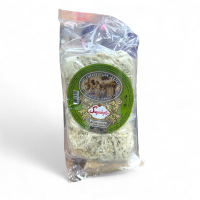 Seyidoğlu Antep Fıstıklı Pişmaniye 125 Gr - Traditional pistachio candy floss in a decorative package, showcasing the unique texture and green pistachio pieces.