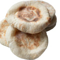 Arrangement of several pieces of Albasha Fresh Baked Pita Bread - 10 Pieces of Soft, Chewy, displaying their fluffy texture and readiness for use in Mediterranean meals.