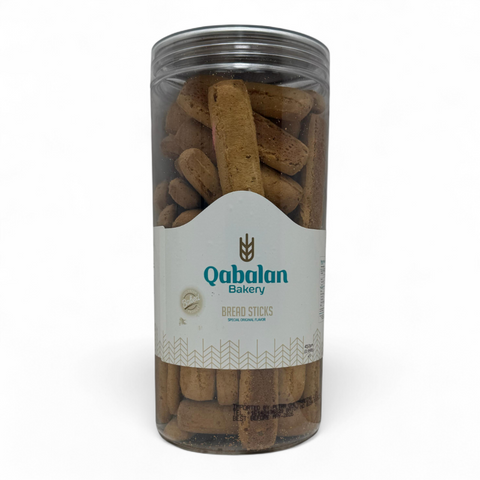 Delicious Qabalan Fingers Sticks Anise 450 G arranged on a wooden table for an appetizing presentation.
