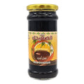 Jar of black honey with golden lid and Arabic label design